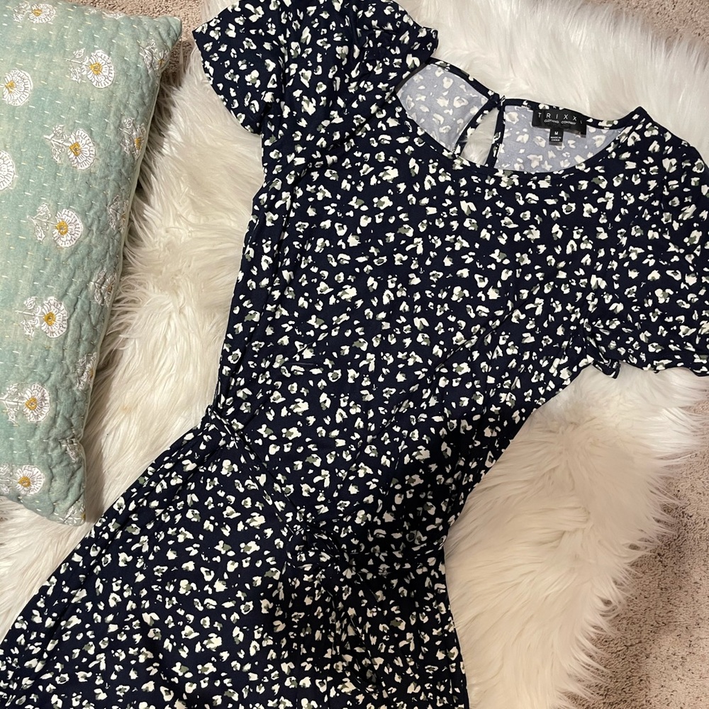 Floral black,cream and green.